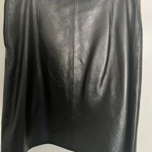Above the knee black leather skirt